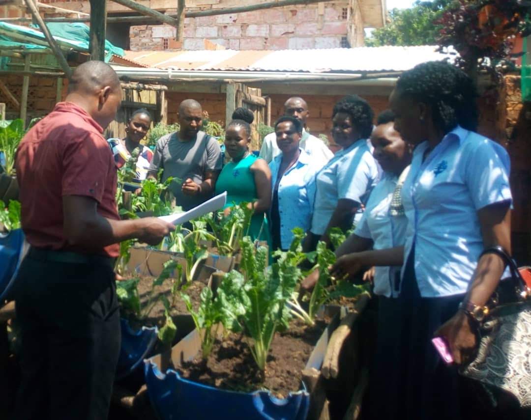 Maria participating in an urban farming training with Teresa Ministries Uganda, supporting practical skills development and community engagement, 2019.