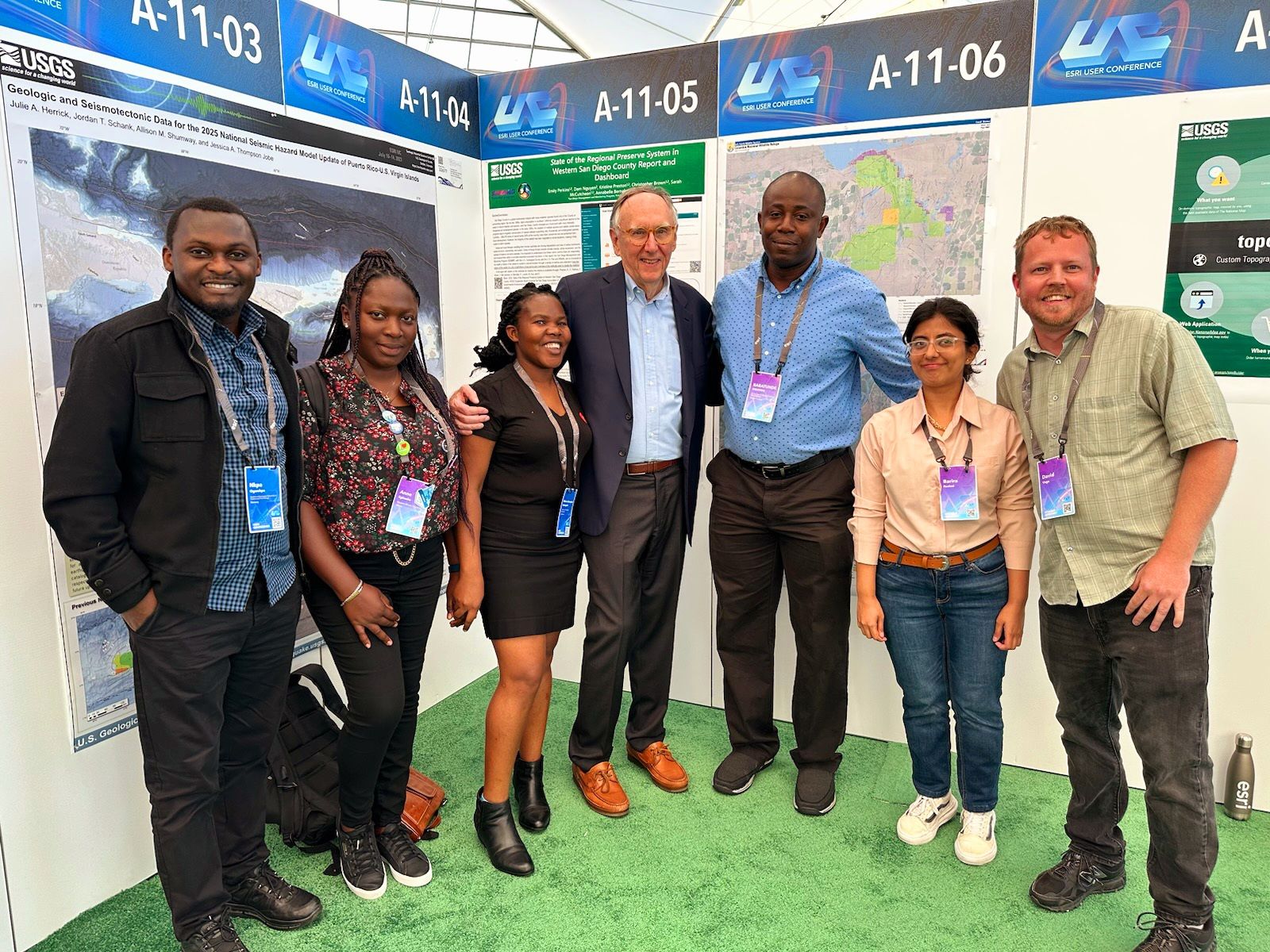 Maria with Esri founder Jack Dangermond and fellow conference participants at the 2023 Esri User Conference in San Diego.