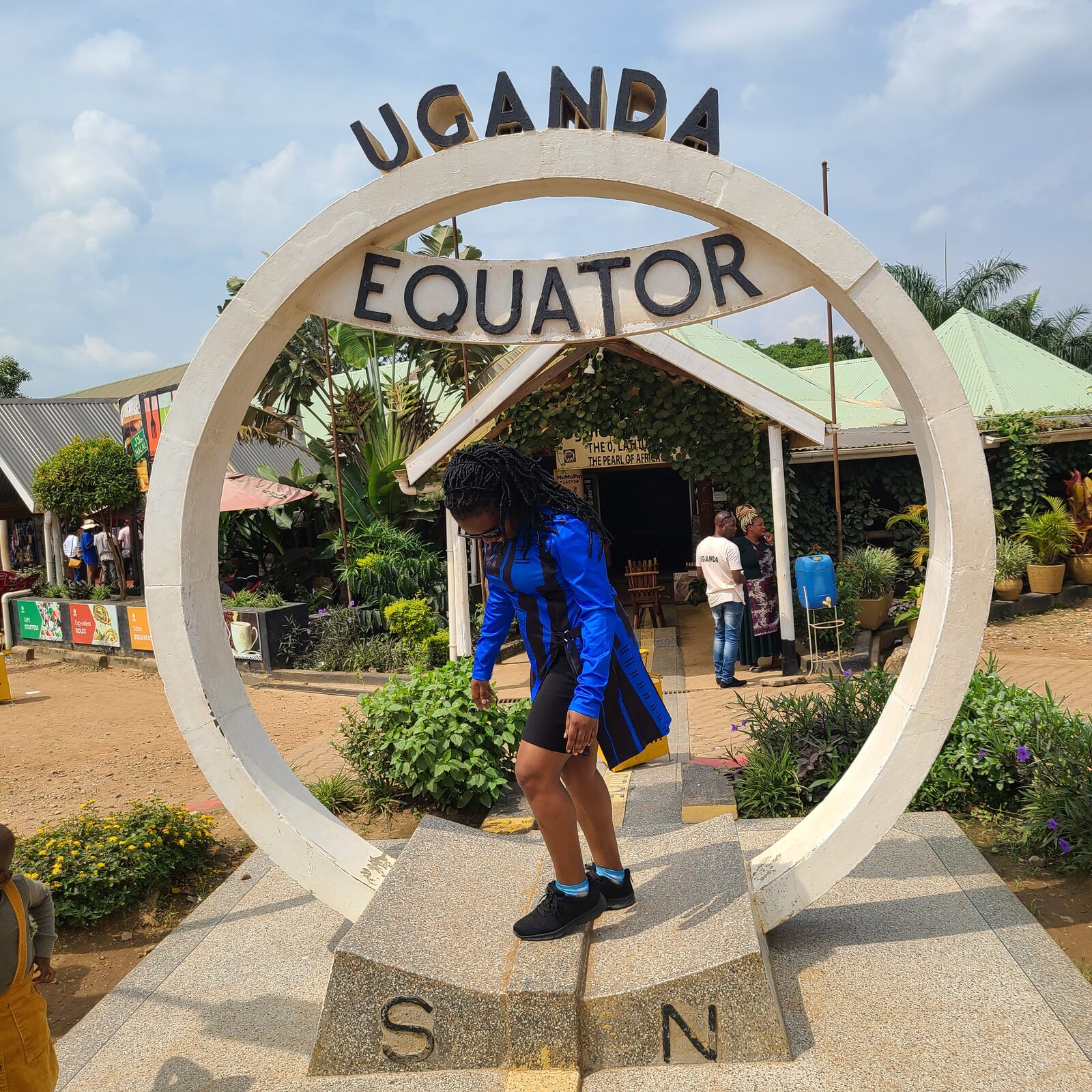 Maria at the Uganda Equator monument, January 2024.