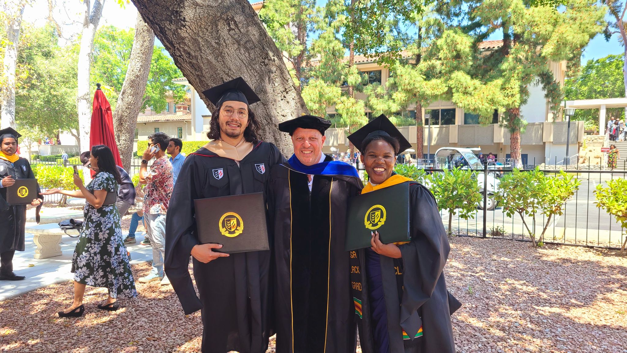 Maria celebrating her graduation from Claremont Graduate University with a Master of Science in Information Systems and Technology, with a concentration in GIS and Solution Development, May 11, 2024.