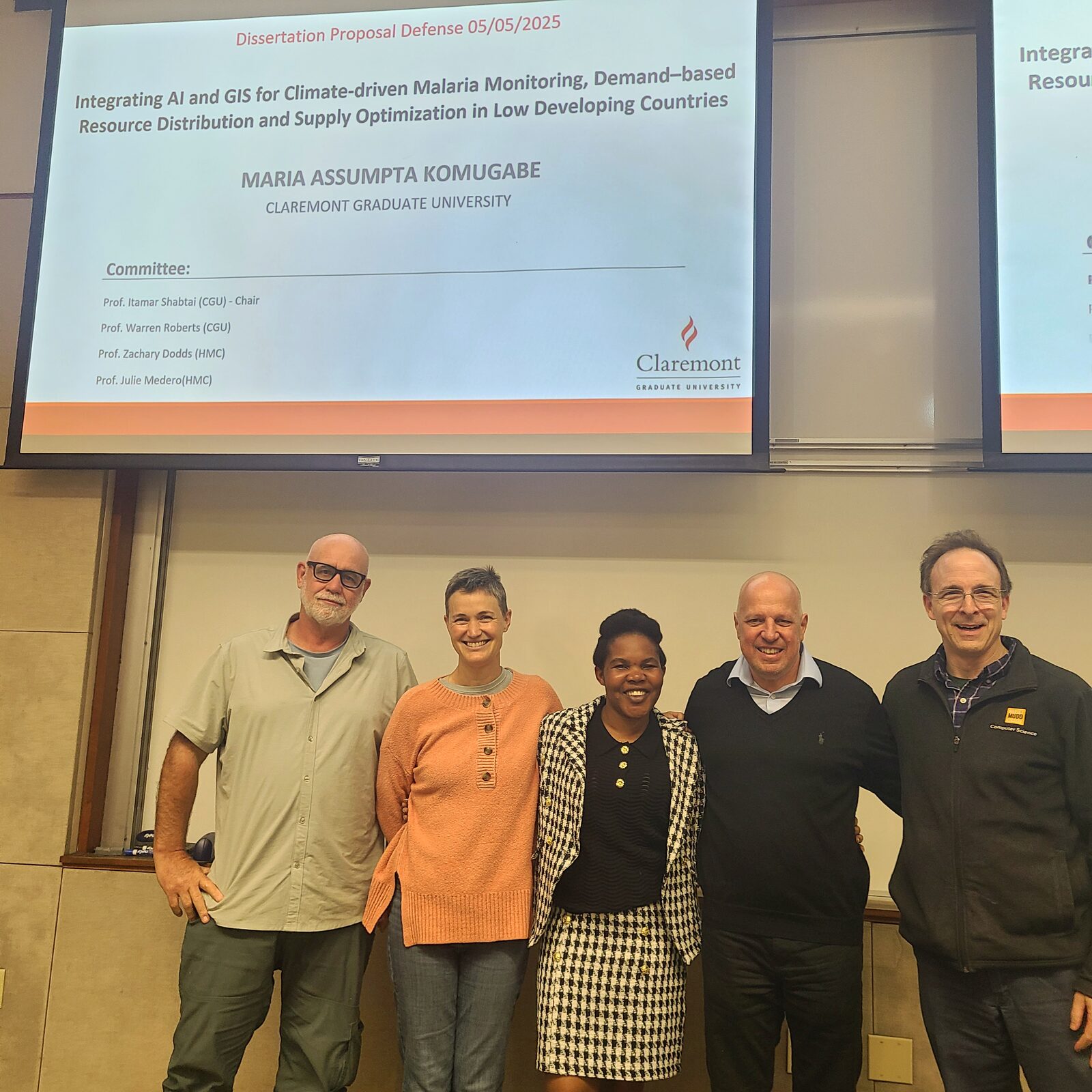 Maria with her dissertation committee following her proposal defense at Claremont Graduate University, May 2025.