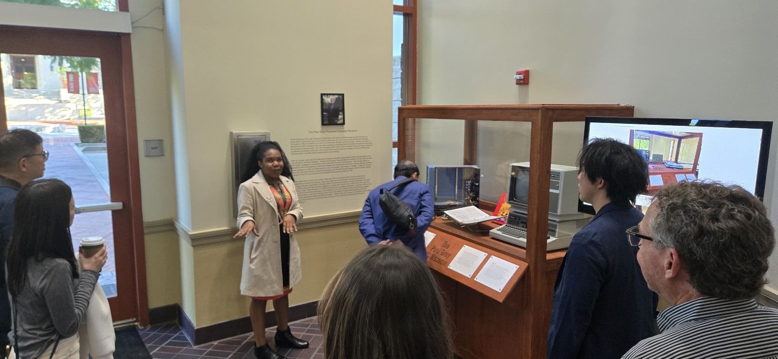 Maria guiding visitors through the Paul Gray Personal Computer Museum during Claremont Graduate University’s Centennial festivities, serving in her role as CISAT Museum Director, October 2025.