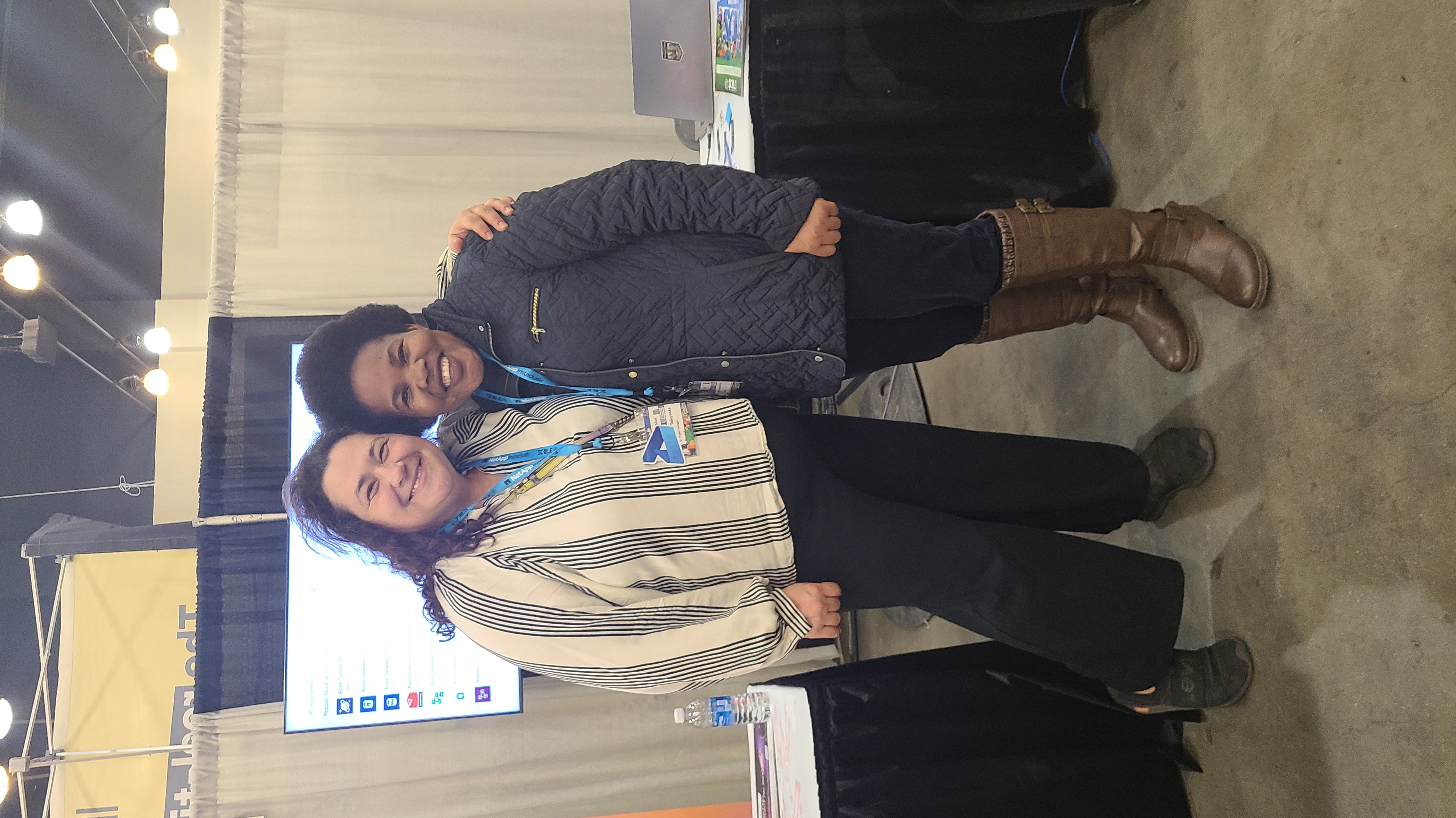 Maria connecting with fellow Claremont Graduate University alumni at SCaLE 22x, the Southern California Linux Expo.